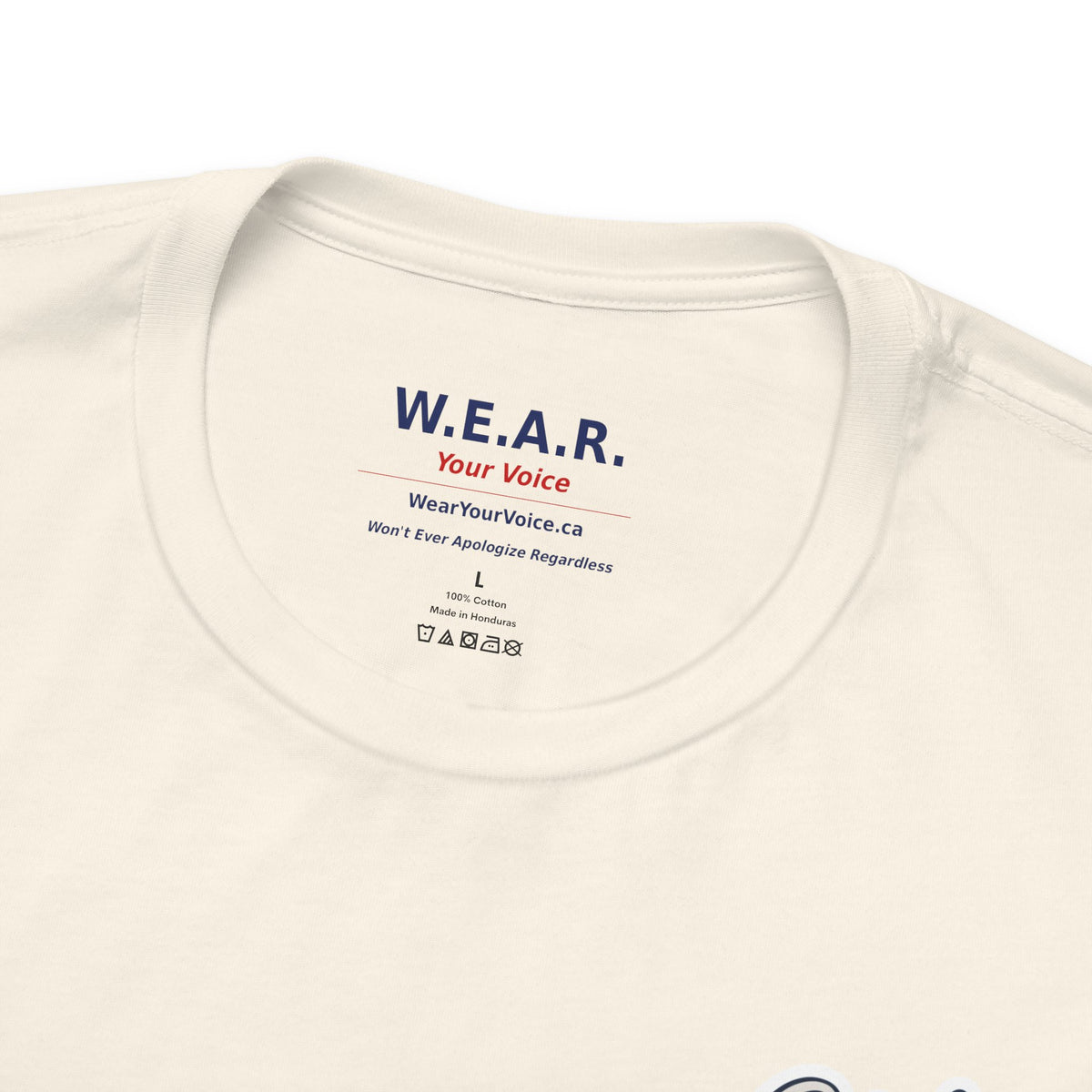 Natural Clown Show Carney tee — inside collar label — W.E.A.R. Your Voice branding, 100% Cotton Made in Honduras